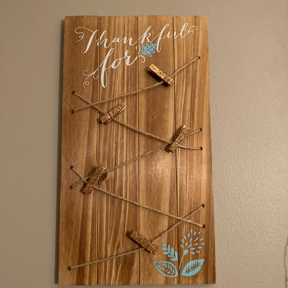 Wooden “thankful for” decor with clips